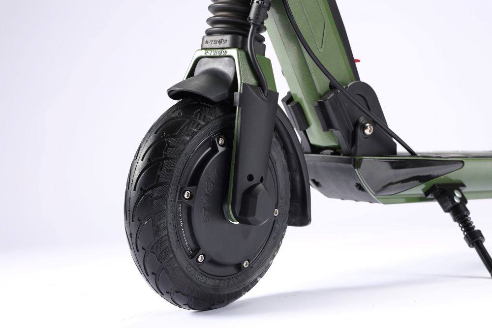 Close-up of a green E Twow GT SL electric scooter wheel on a white background