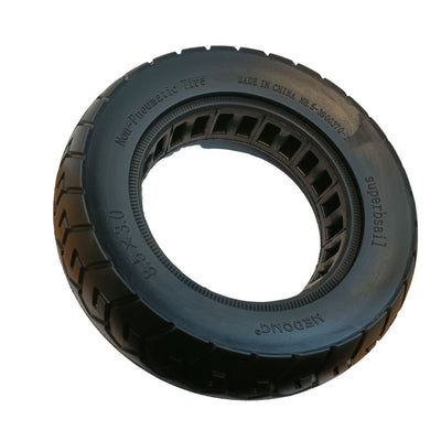 Black tire with tread pattern on a white background
