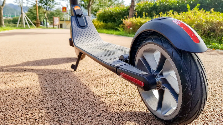 Close up shot of an electric scooter parked outdoors