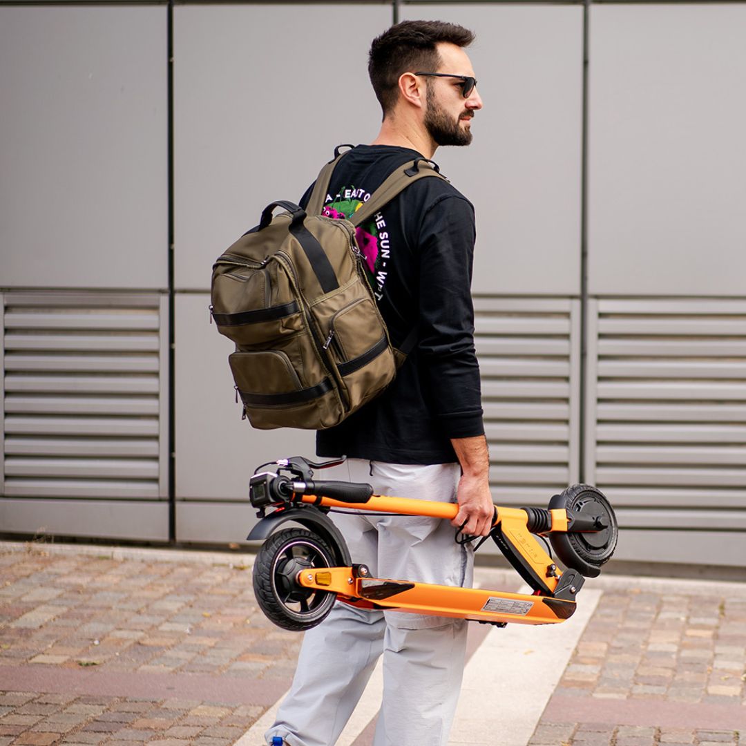 E-Twow GT SL folded to carry easily. 13 kg e-scooter. Ultra light electric scooter.