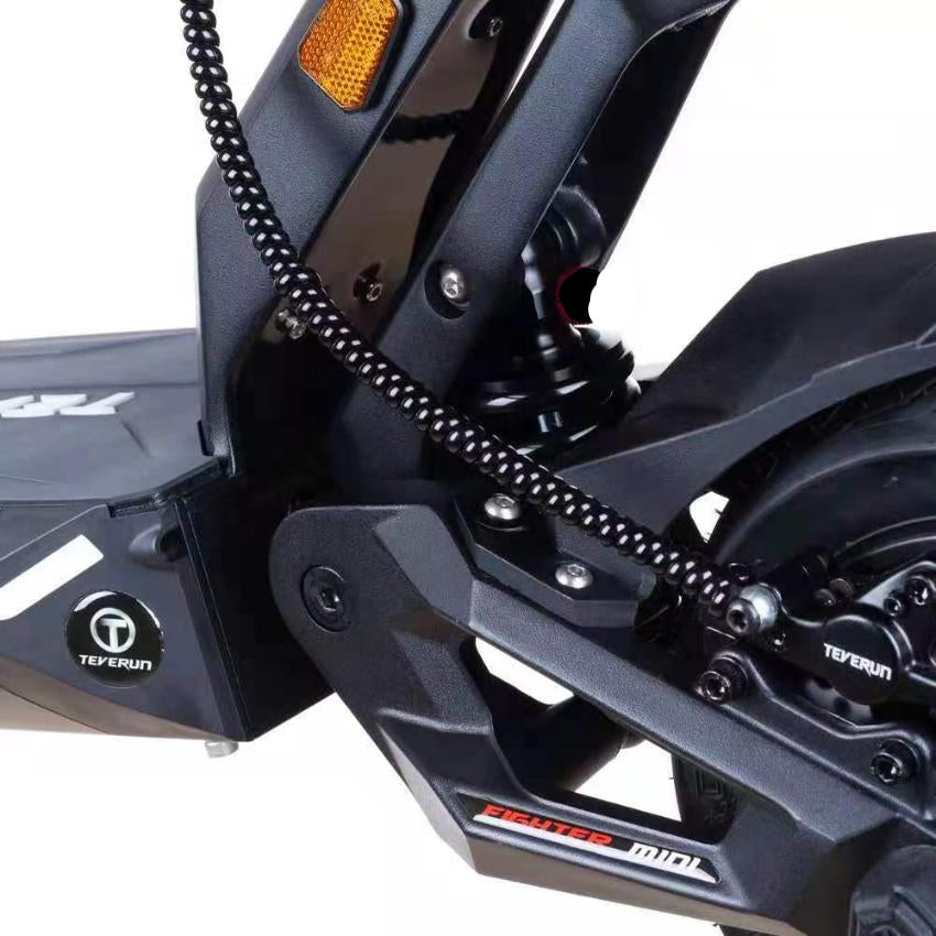 Close-up of a Teverun Fighter 11  front suspension with 'Teverun' branding on a white background.