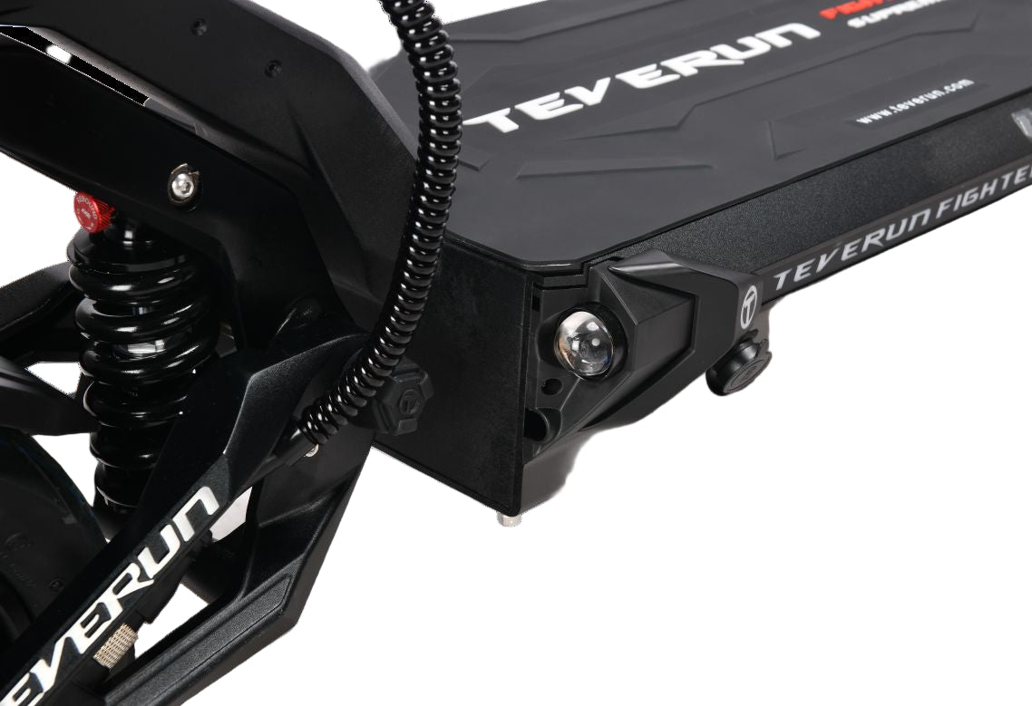 Close-up of a black Teverun Fighter Supreme Ultra electric scooter suspension system with 'TEVERUN' branding.