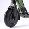 Close-up of a green E Twow GT SL electric scooter wheel on a white background