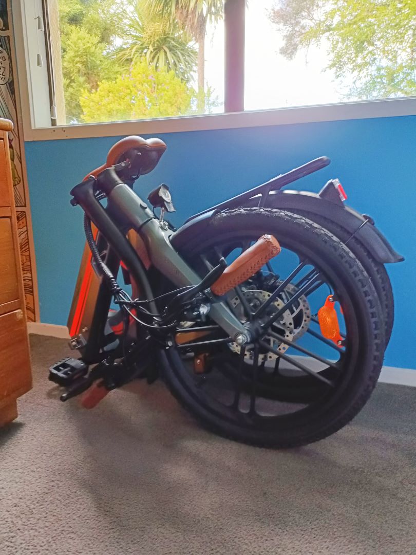 Folding e-bike. Folded and stored at home
