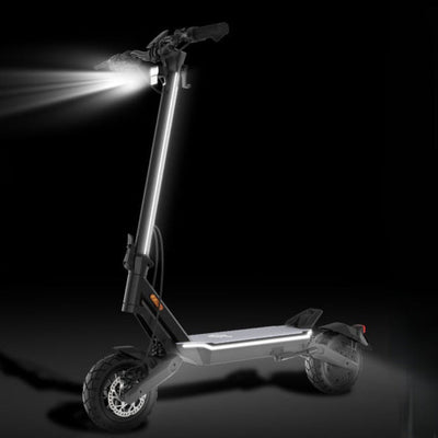 Electric scooter with headlights on a black background